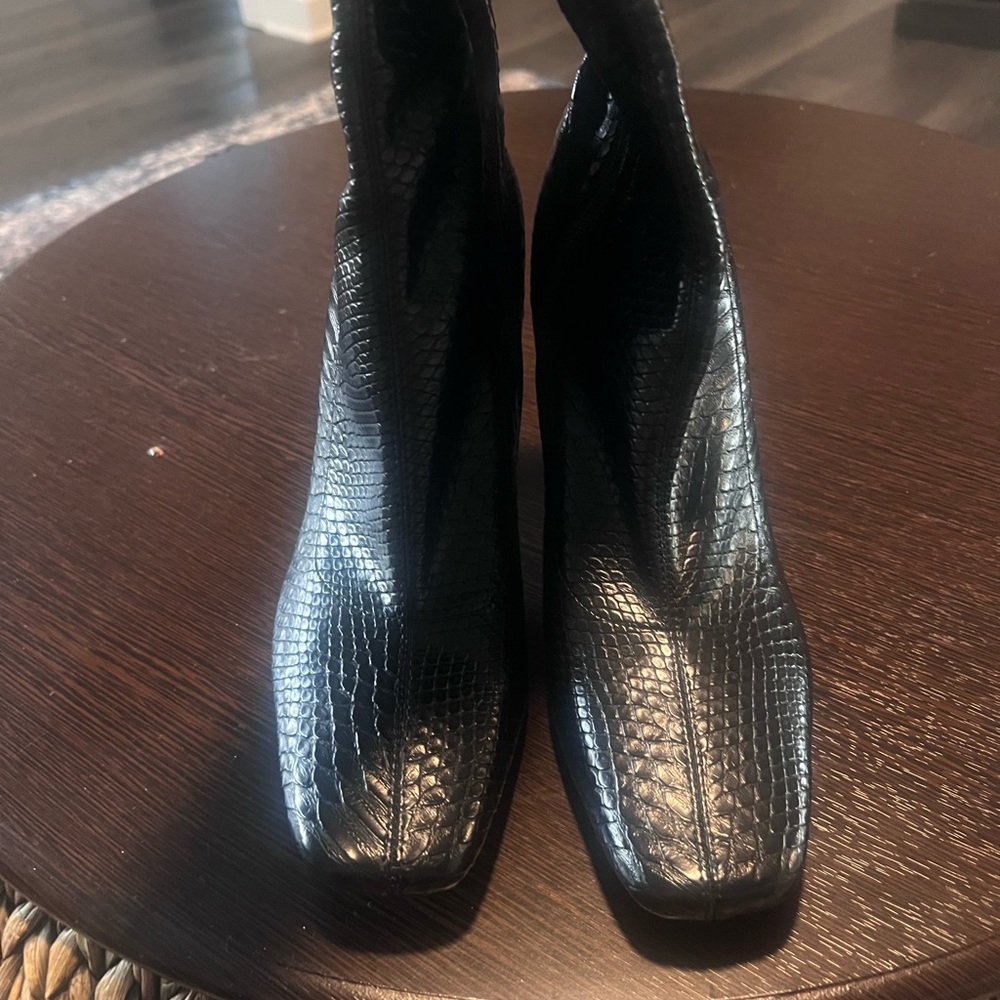 Never worn. In original box. Zipped booties with croc leather design.